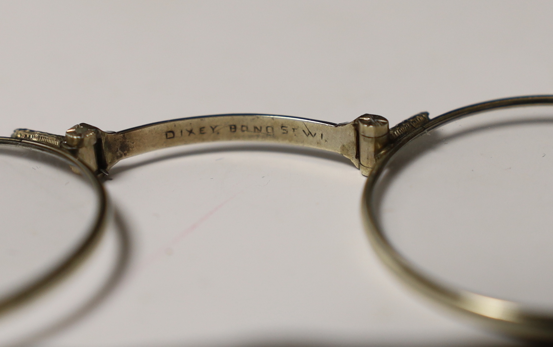 C. W. Dixey & Sons, a pair of white metal lorgnettes, in a leather case